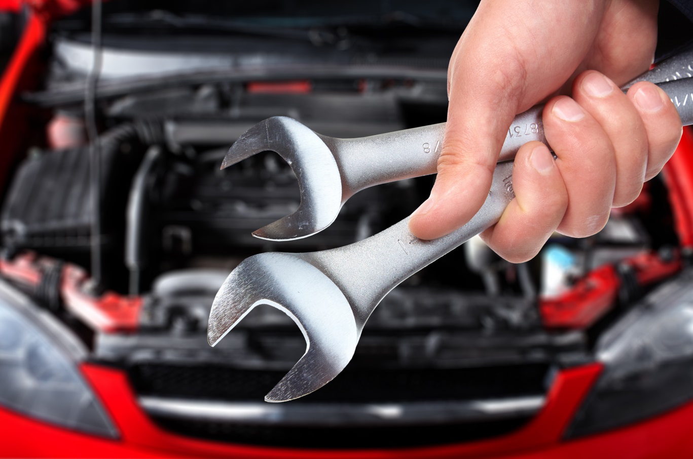 Professional automotive restoration and repair workshop showcasing precision craftsmanship and modern equipment